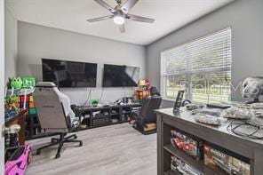 office space with light hardwood / wood-style flooring and ceiling fan