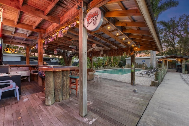 wooden deck featuring an outdoor bar