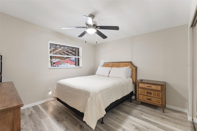 bedroom with ceiling fan and light wood-type flooring