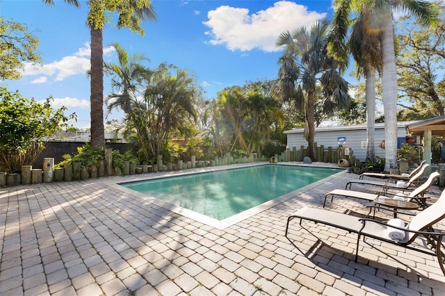 view of swimming pool featuring a patio area