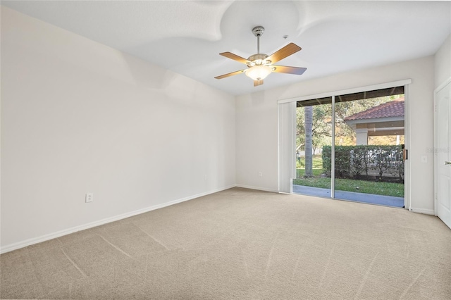 carpeted empty room with ceiling fan