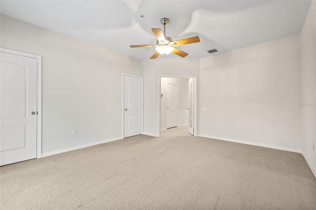 unfurnished bedroom with light carpet and ceiling fan