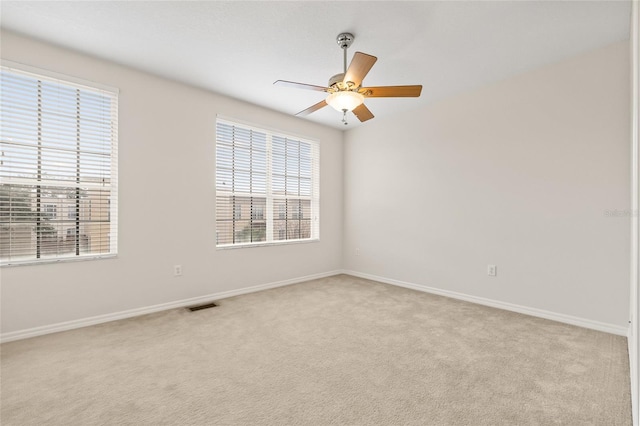 carpeted empty room with ceiling fan