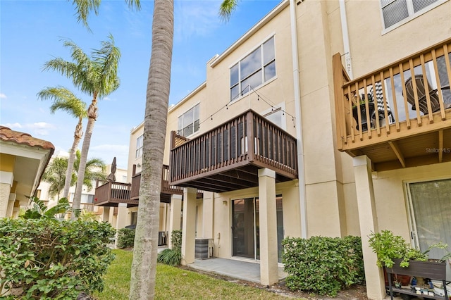 rear view of property with a balcony