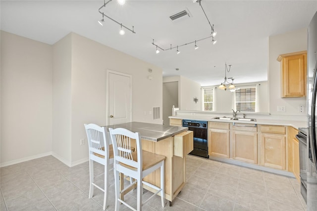 kitchen featuring range with electric stovetop, decorative light fixtures, black dishwasher, sink, and kitchen peninsula