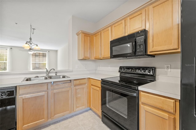 kitchen with light brown cabinetry, decorative light fixtures, sink, light tile patterned floors, and black appliances