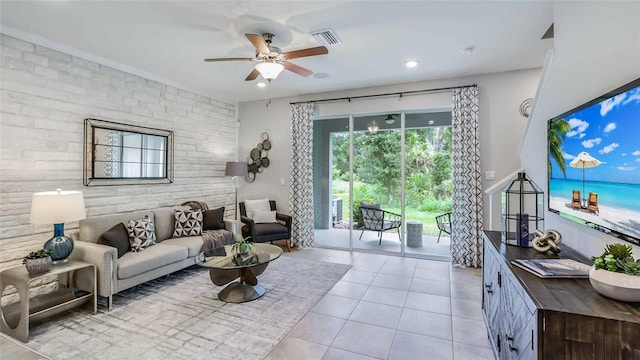 tiled living room with ceiling fan