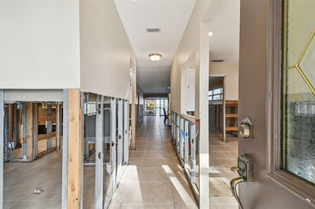 hall with light tile patterned flooring