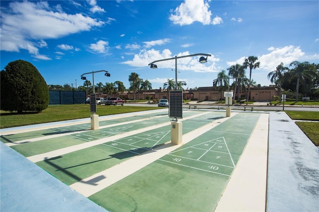 view of property's community with a yard