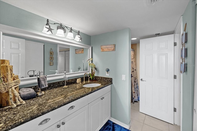 bathroom featuring tile patterned floors and vanity