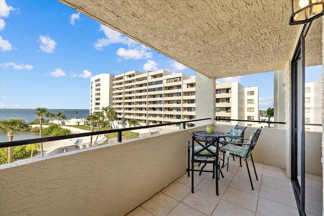 balcony featuring a water view