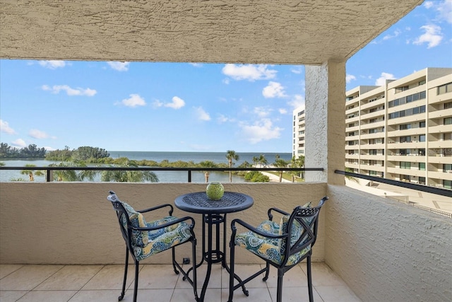 balcony featuring a water view