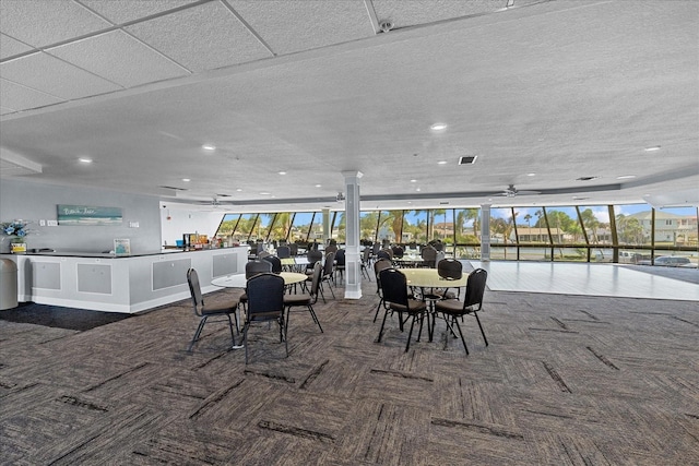 dining space featuring expansive windows