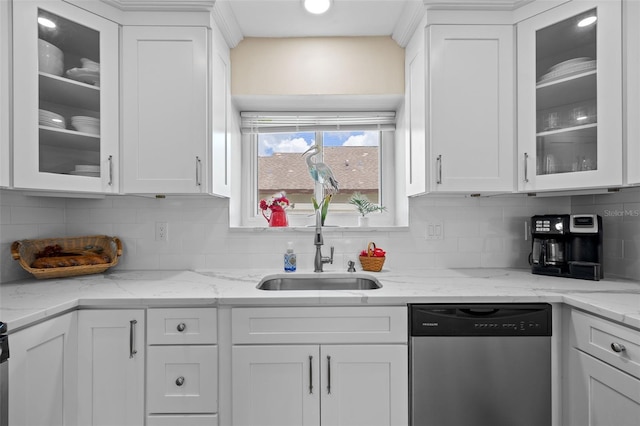 kitchen featuring dishwasher, light stone countertops, white cabinets, and decorative backsplash