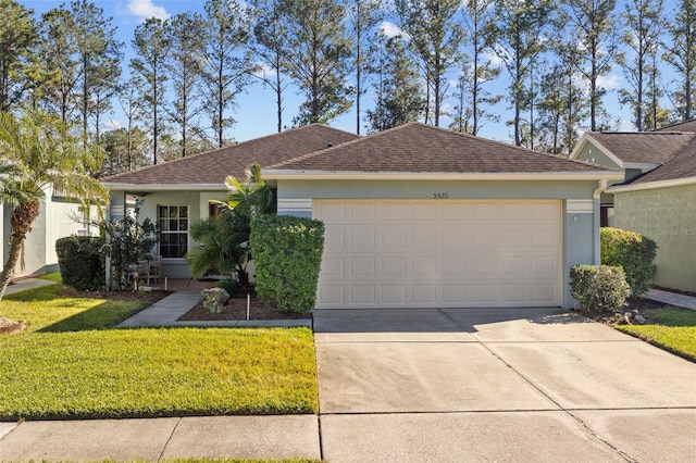 ranch-style home featuring a front yard and a garage