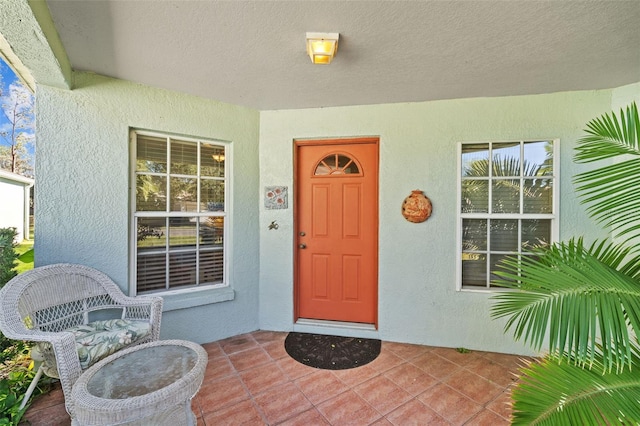 doorway to property with a porch