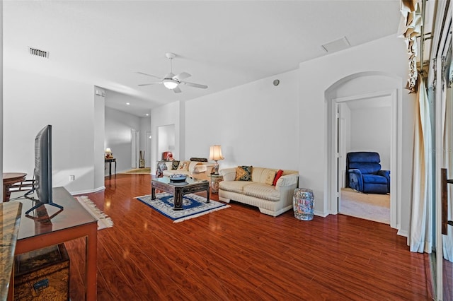 living room with ceiling fan and wood-type flooring