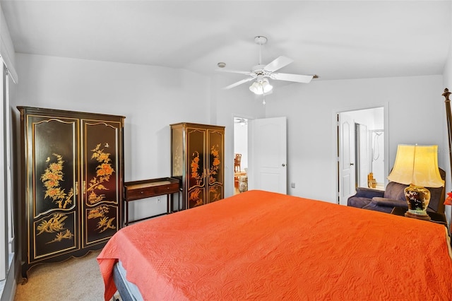 bedroom with ceiling fan, light carpet, and vaulted ceiling