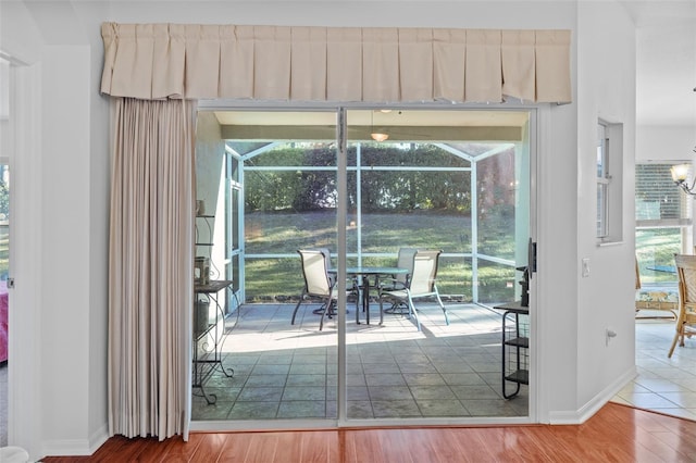 doorway to outside featuring hardwood / wood-style floors and plenty of natural light