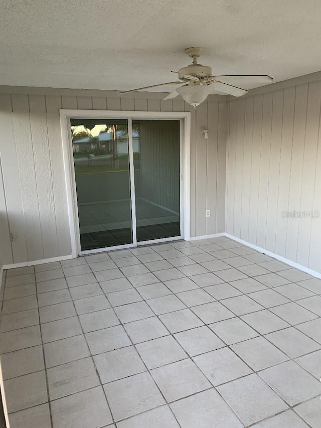 view of patio featuring ceiling fan