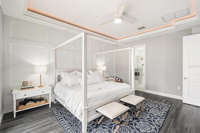 bedroom with ceiling fan, dark hardwood / wood-style flooring, and crown molding