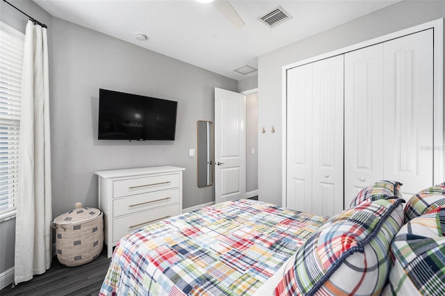 bedroom featuring ceiling fan, a closet, and dark hardwood / wood-style floors