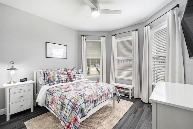 bedroom featuring ceiling fan and dark wood-type flooring