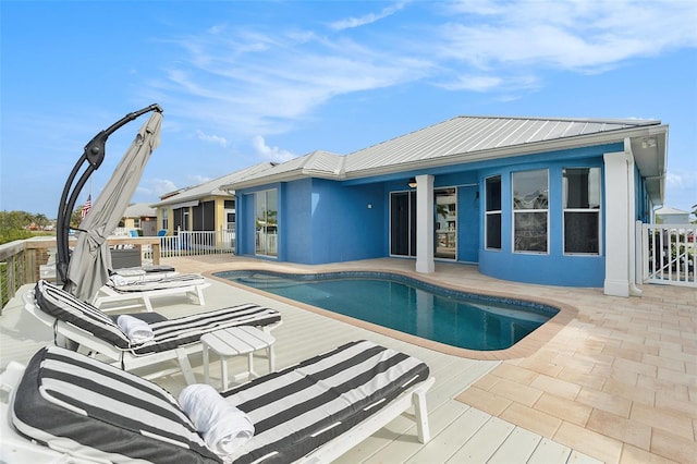 view of swimming pool featuring a patio