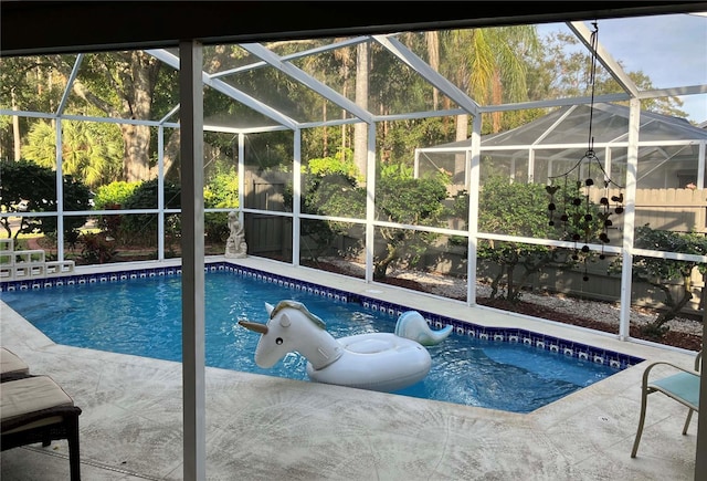 view of pool featuring a patio and a lanai