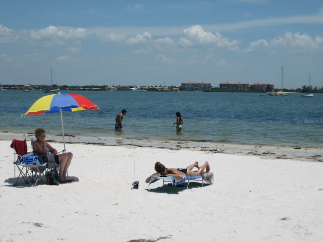 property view of water featuring a beach view