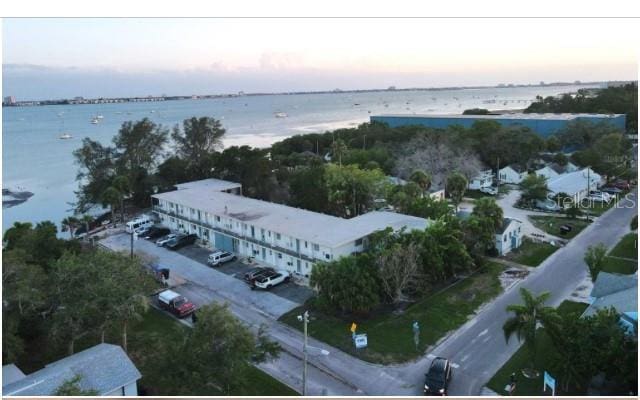 aerial view at dusk with a water view