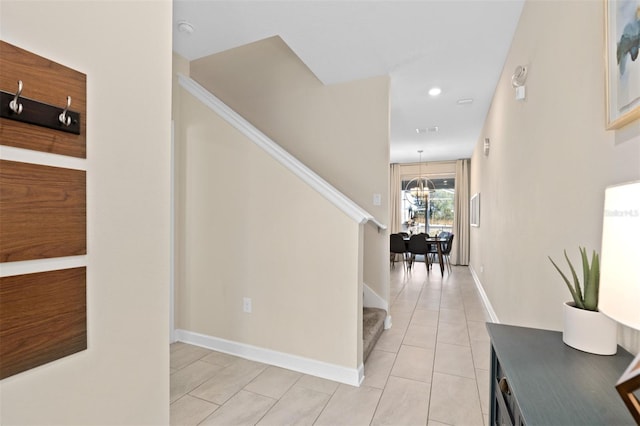 corridor featuring light tile patterned flooring