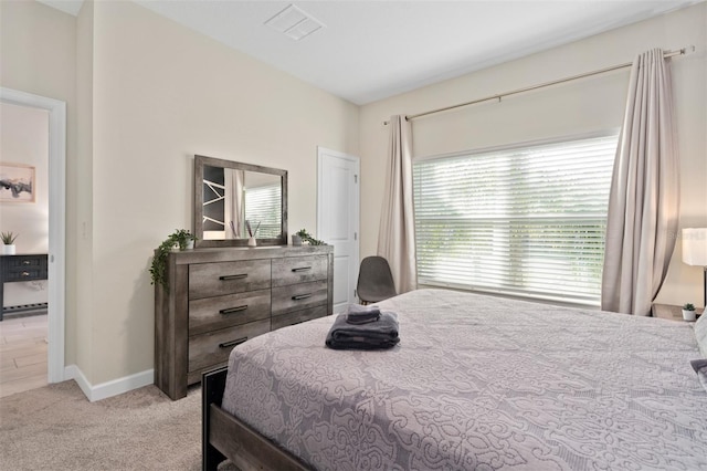 bedroom with light colored carpet