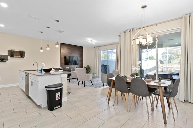 dining room with sink and a chandelier