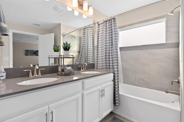 bathroom with shower / bath combination with curtain and vanity