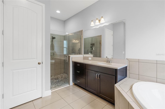 bathroom with vanity, tile patterned floors, and independent shower and bath