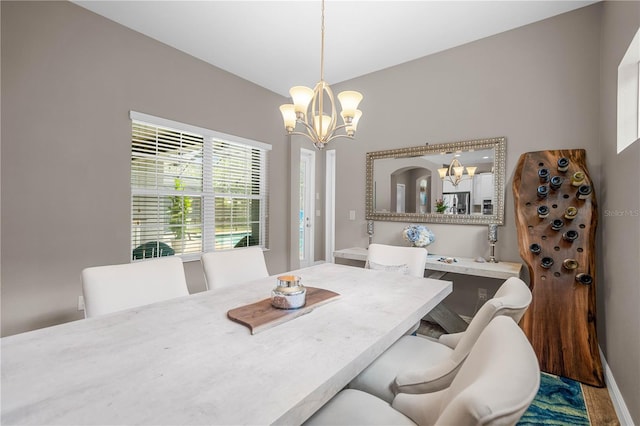 dining area with a notable chandelier