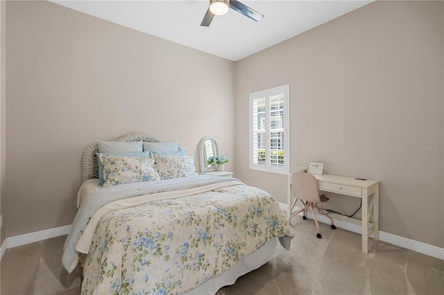 bedroom featuring ceiling fan and light carpet