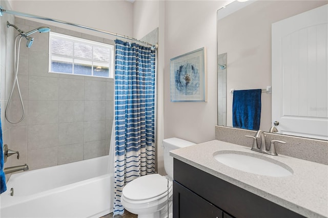 full bathroom with shower / tub combo, vanity, and toilet