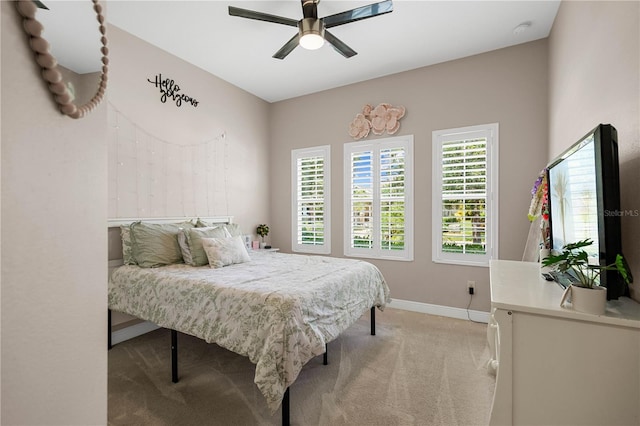 bedroom featuring ceiling fan and light colored carpet