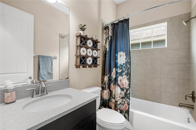 full bathroom with vanity, toilet, and shower / tub combo with curtain