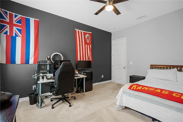 bedroom featuring ceiling fan and light carpet