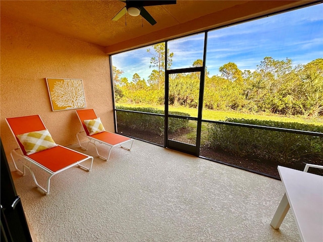 sunroom / solarium with ceiling fan