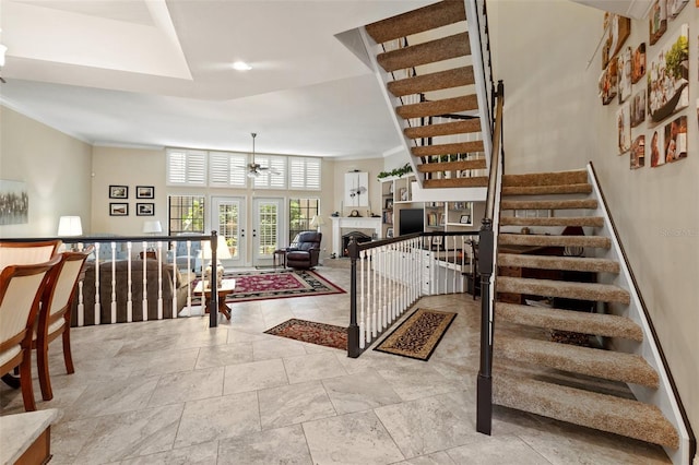 staircase with a high ceiling