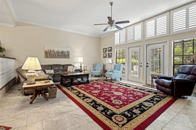 living room with ceiling fan and ornamental molding