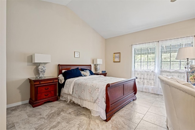 bedroom featuring lofted ceiling