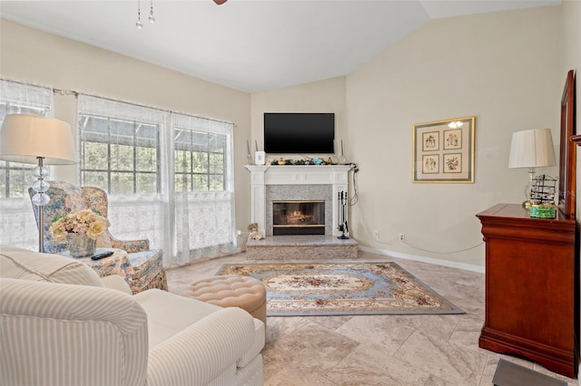 living room featuring lofted ceiling