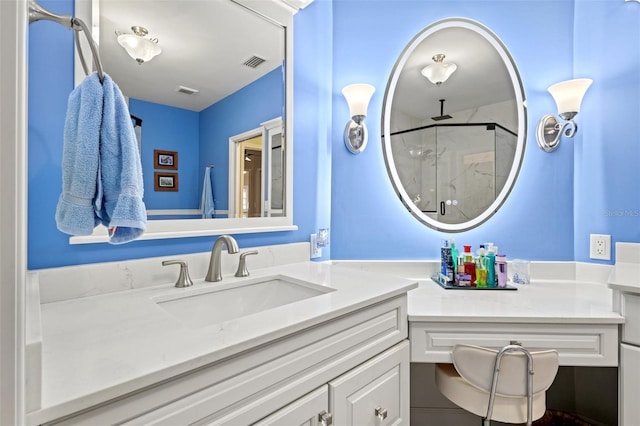 bathroom with vanity and a shower with door