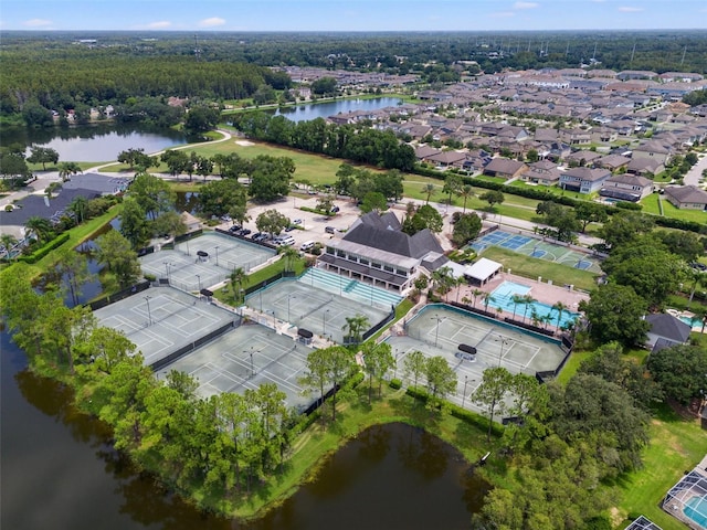 birds eye view of property with a water view