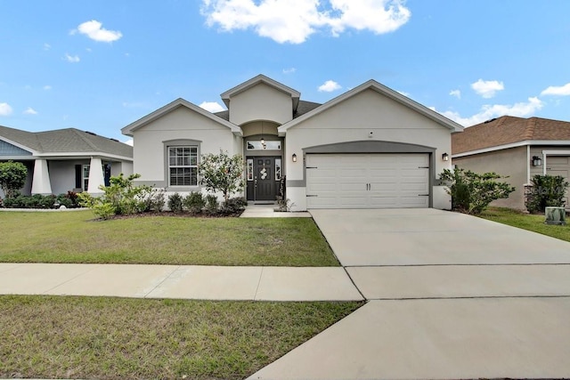 single story home featuring a front yard and a garage